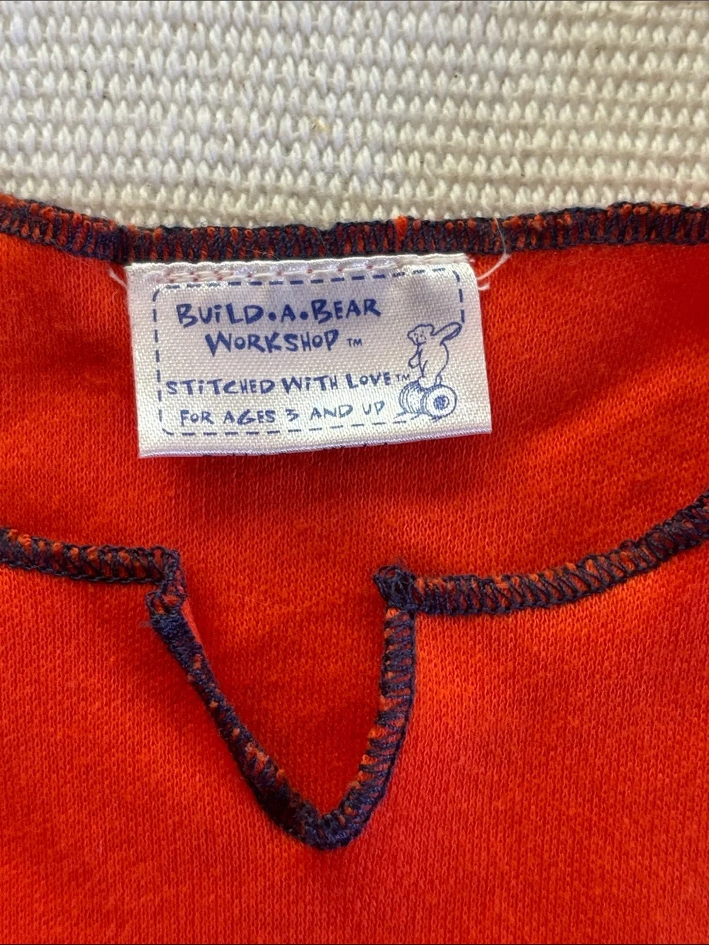 Build-A-Bear outfit orange shirt with Navy Stitching and denim mini skirt